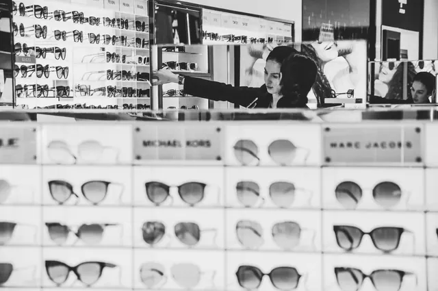 Stylish eyewear shopping with a focus on designer brands in a modern store. Customer segmentation explained for business teams in 2027